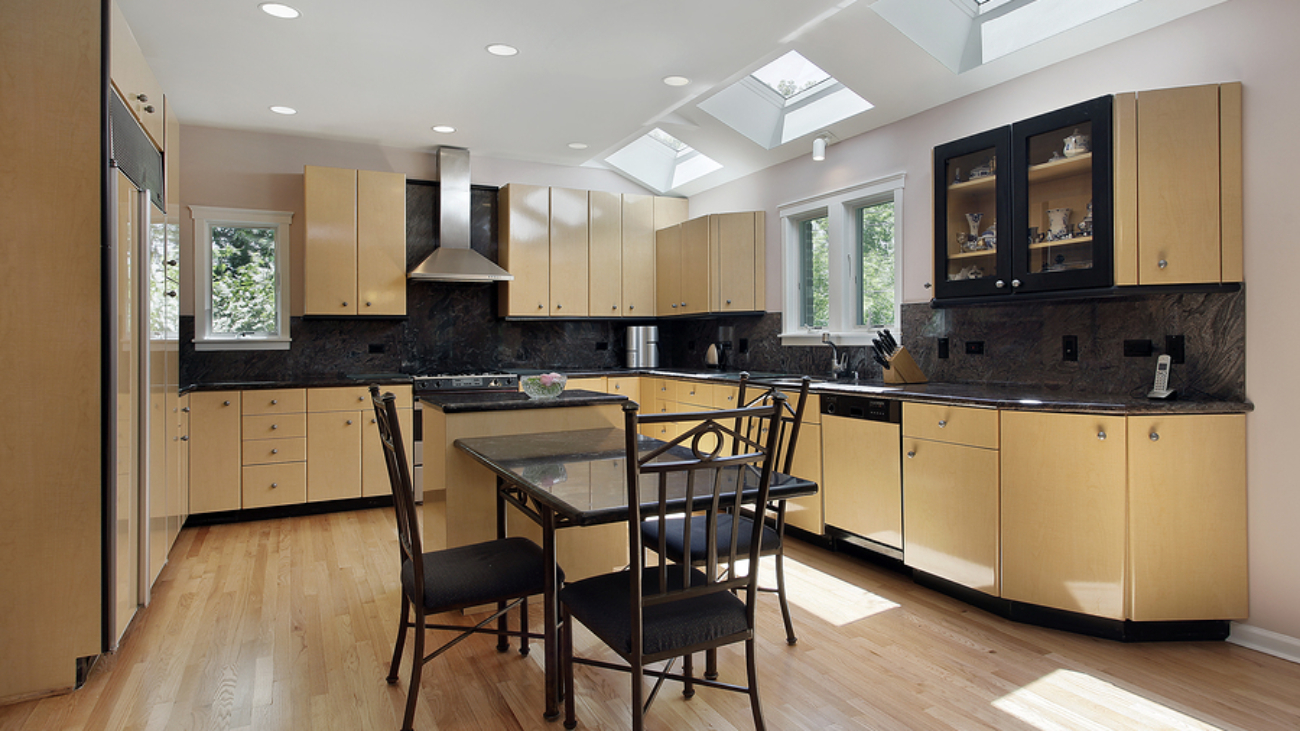 Kitchen in modern home with three skylights